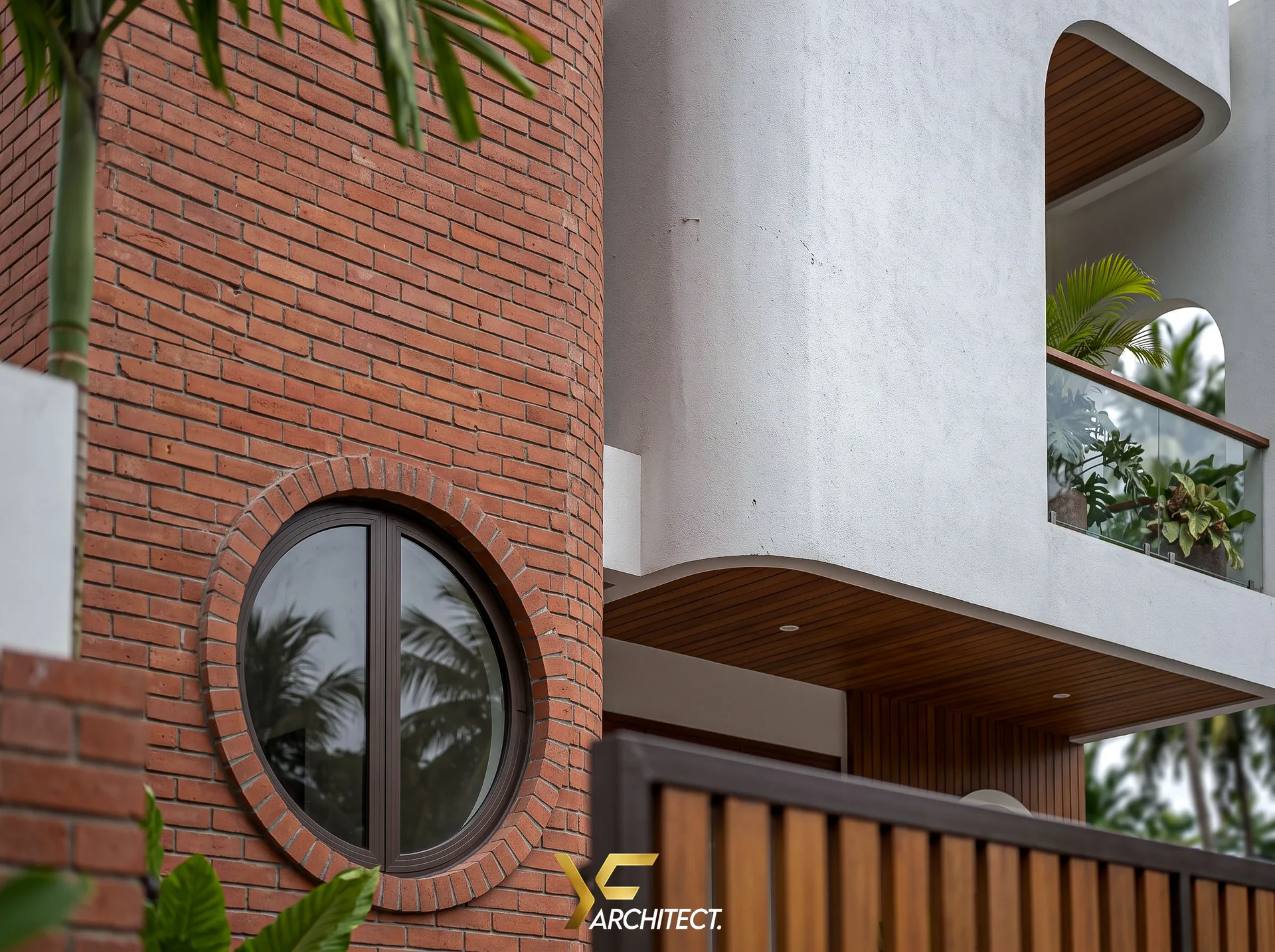 MS. TASYA HOUSE — Close detail — round window, terracotta & teak